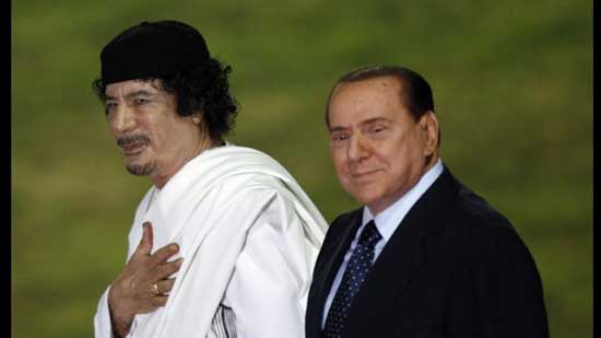 القذافي مع سيلفيو برلسكوني رئيس الوزراء الايطالي السابق - أرشيفية