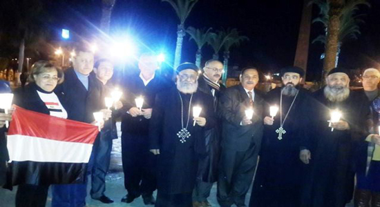  وقفة صامتة بالشموع لأقباط ومسلمي بورسعيد على أرواح شهداء ليبيا