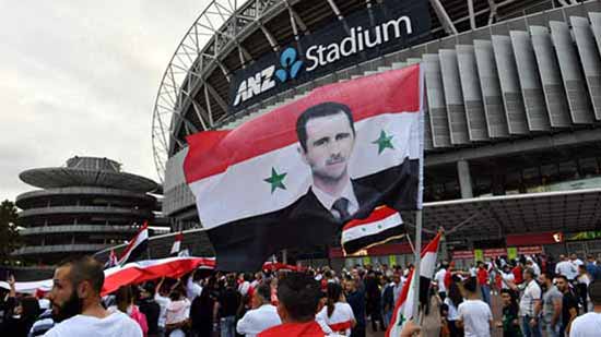شاهد.. جماهير سوريا ترفع صور بشار الأسد فى مباراة أستراليا